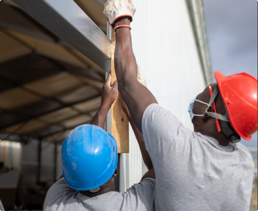 Workers installing an approved signage structure