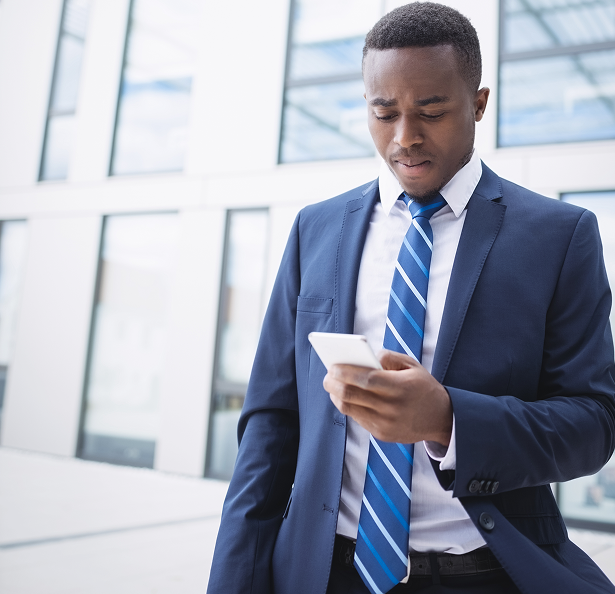 Person using mobile phone for permit renewal